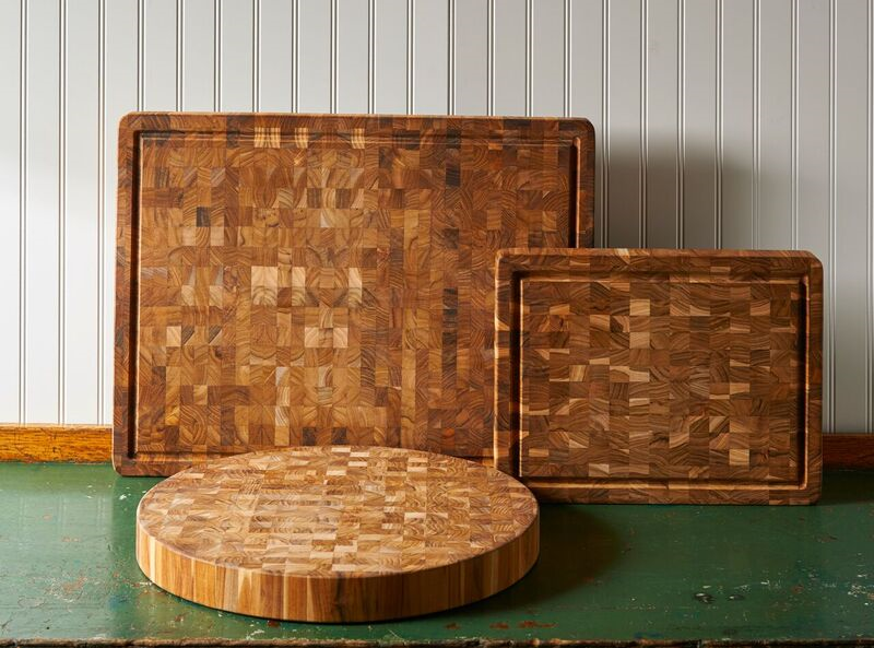 Round and rectangular wooden cutting boards on a vintage table