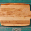 Wooden cutting board on a turquoise wooden table background