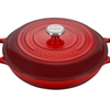 Red enameled cast iron Dutch oven with lid on white background