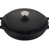 Black Le Creuset cast iron Dutch oven with lid on white background