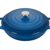 Blue enameled cast iron Dutch oven by Le Creuset on white background