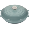 Duck egg blue enameled cast iron casserole dish by Le Creuset.