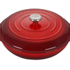 Red Le Creuset round cast iron Dutch oven on white background