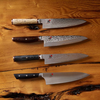 Japanese chef knives with unique handles on wooden background